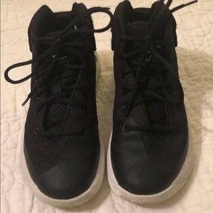 Little boys size 1 under armour tennis shoes.